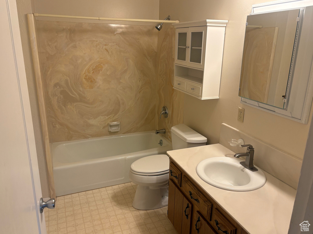 Full bathroom with toilet, vanity, and bathtub / shower combination