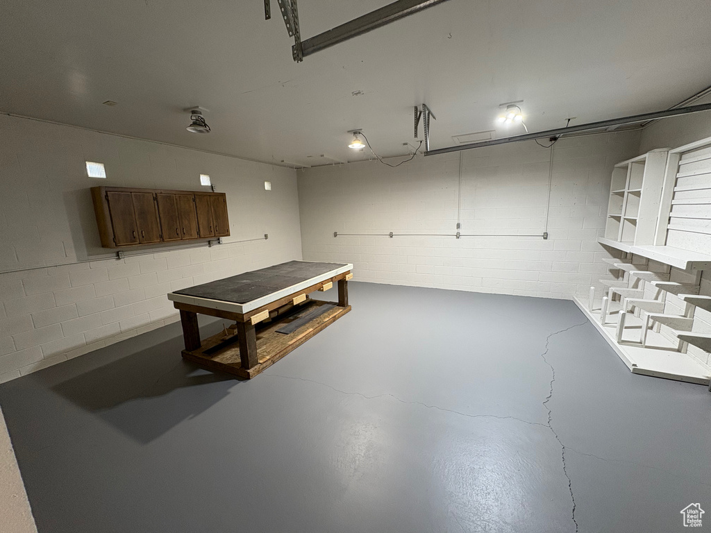 Garage featuring concrete block wall