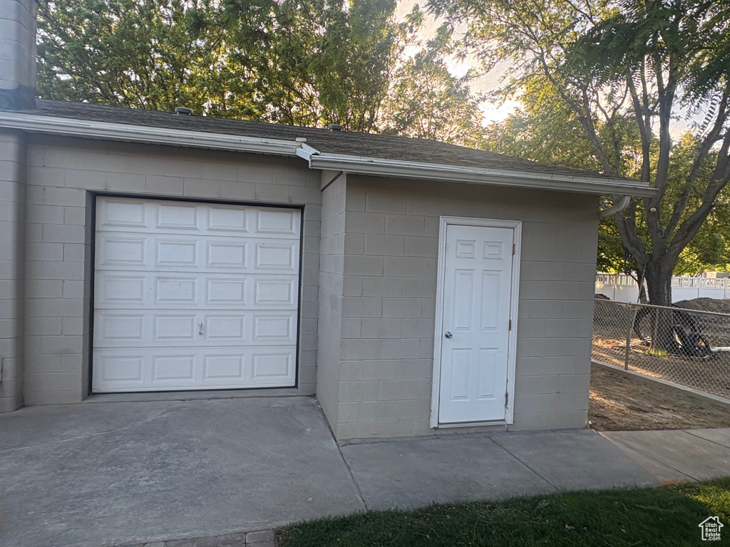 Garage with concrete driveway