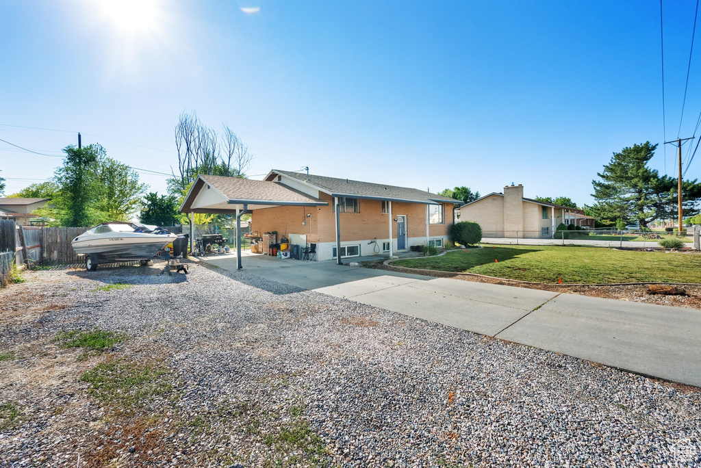 View of front of home with gravel driveway