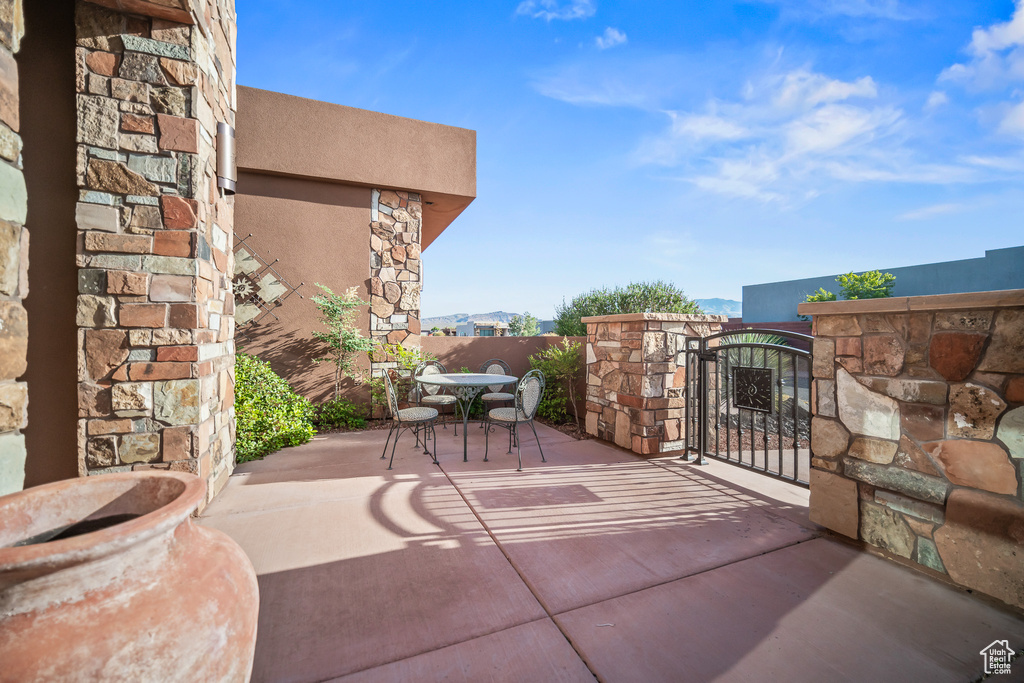 View of patio with a gate