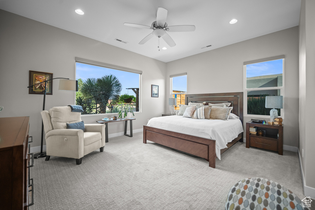 Bedroom with light colored carpet, baseboards, a ceiling fan, and recessed lighting