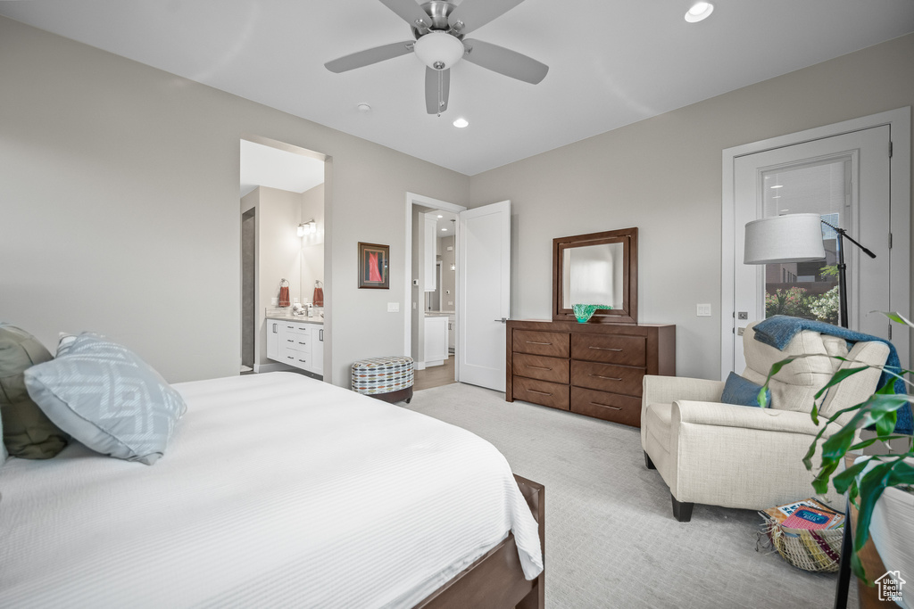 Bedroom featuring light colored carpet, recessed lighting, ensuite bath, and ceiling fan