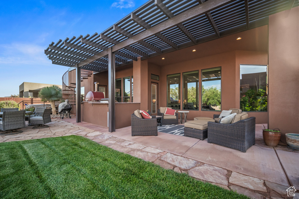 View of patio / terrace with outdoor lounge area, exterior kitchen, and a pergola