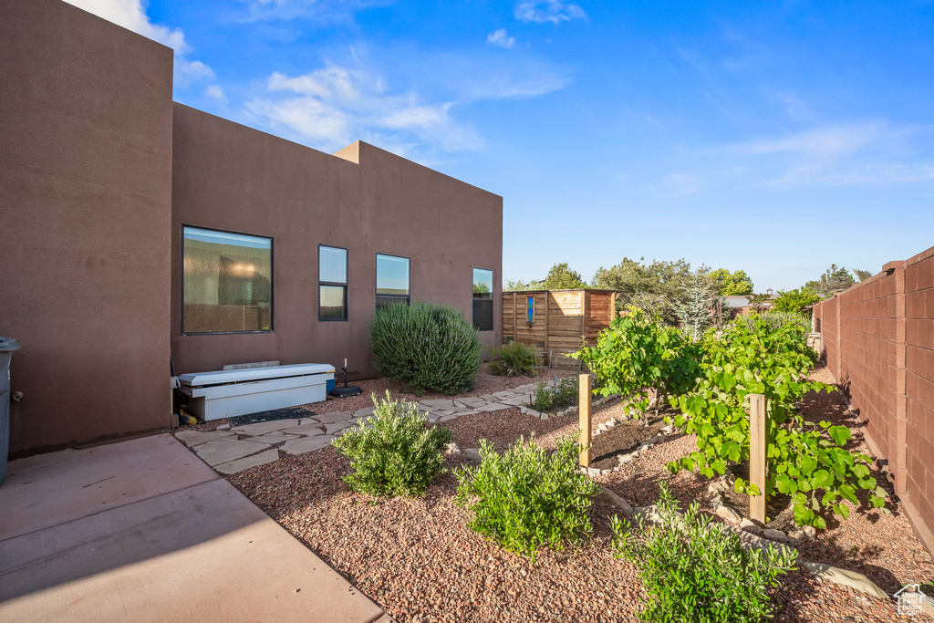 Fenced backyard with a vegetable garden