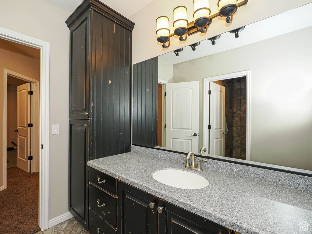 Bathroom with vanity and baseboards