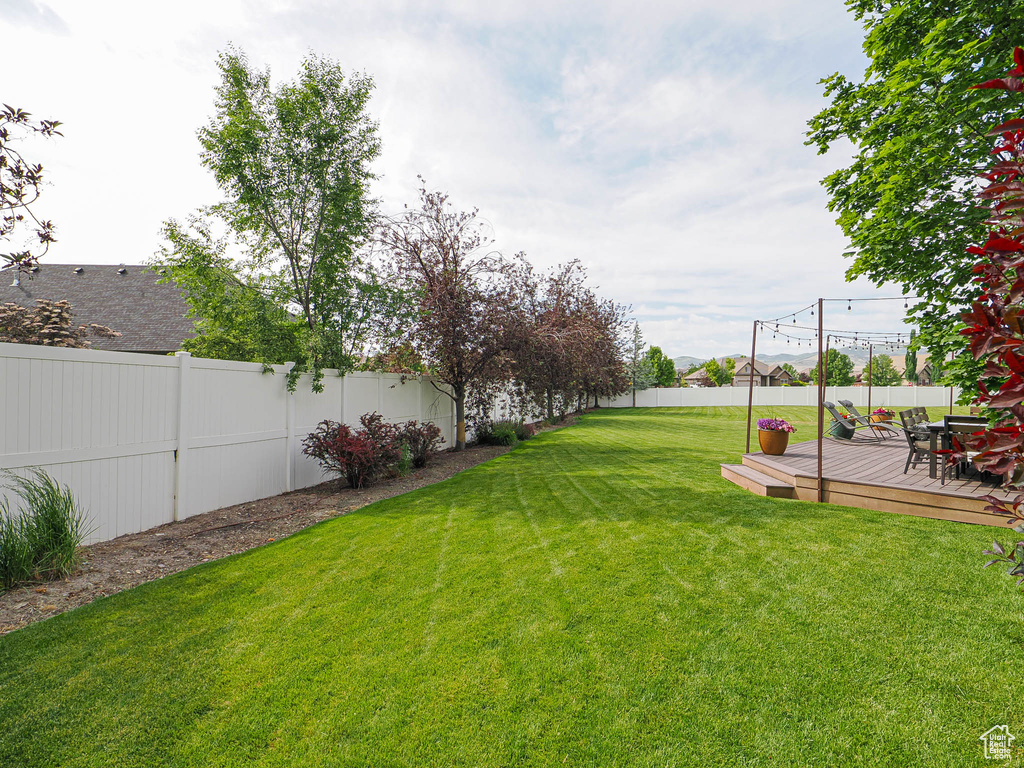 View of yard with a deck