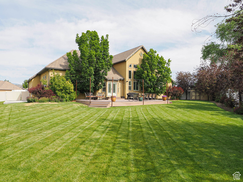 View of yard featuring a patio area and french doors