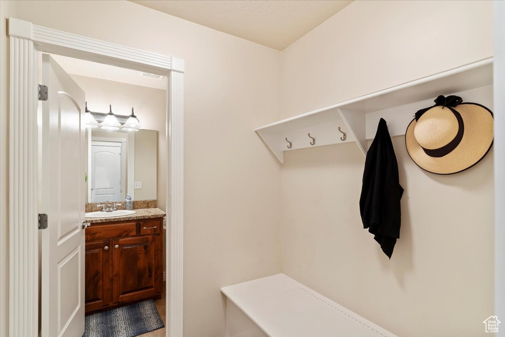 Mudroom featuring a sink