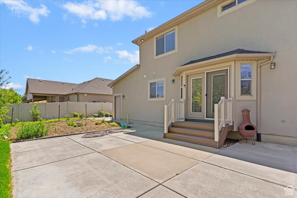 Back of house featuring a patio and stucco siding