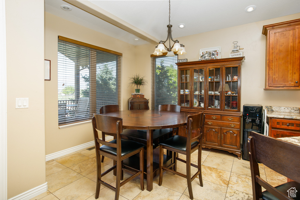 Dining space featuring a chandelier, recessed lighting, baseboards, and light tile patterned floors