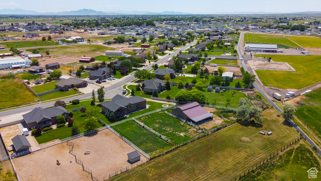 Aerial view of property's location featuring nearby suburban area and a mountain backdrop