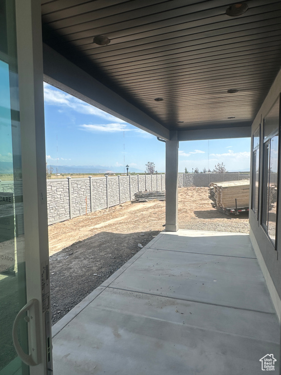 Fenced backyard with a patio area