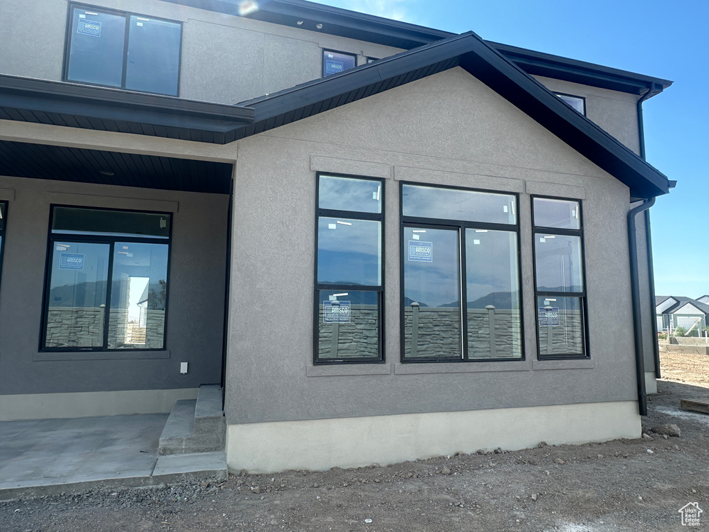 View of side of property with stucco siding