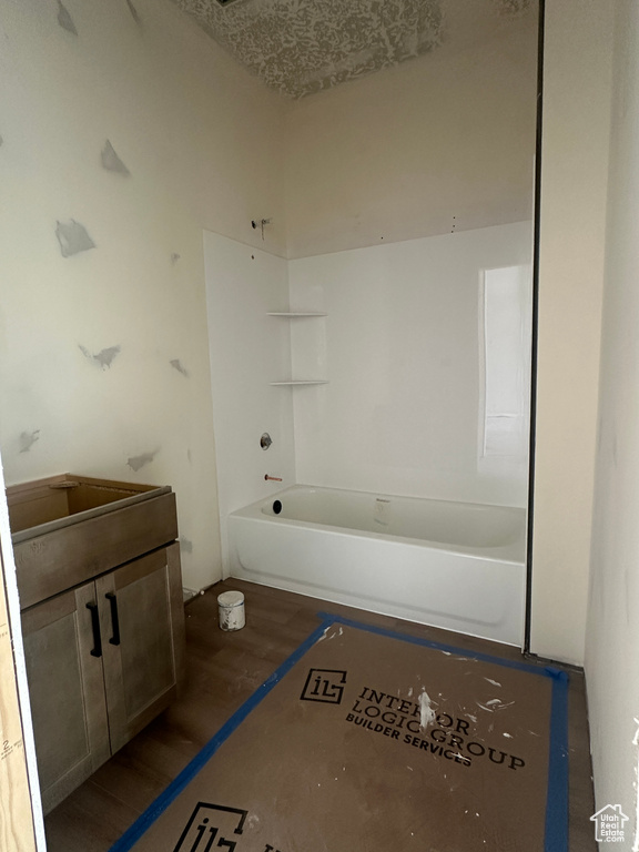 Bathroom featuring vanity and shower / washtub combination