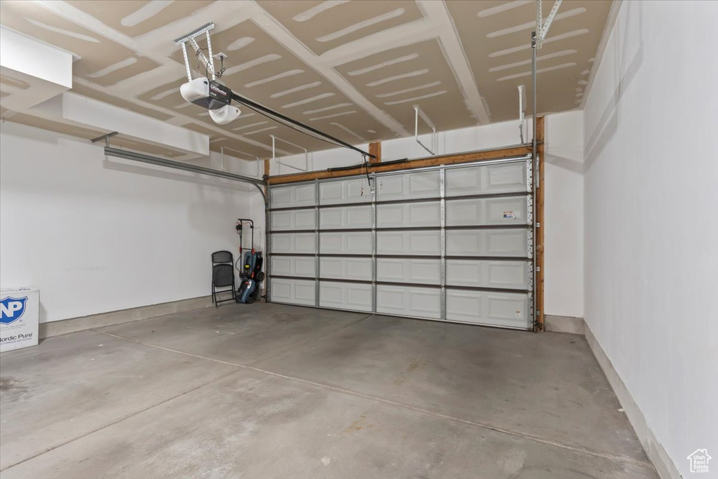Garage featuring a garage door opener