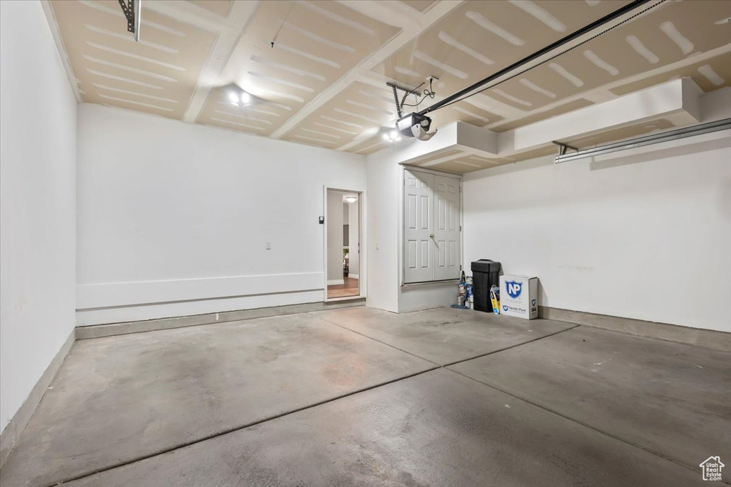 Garage featuring a garage door opener