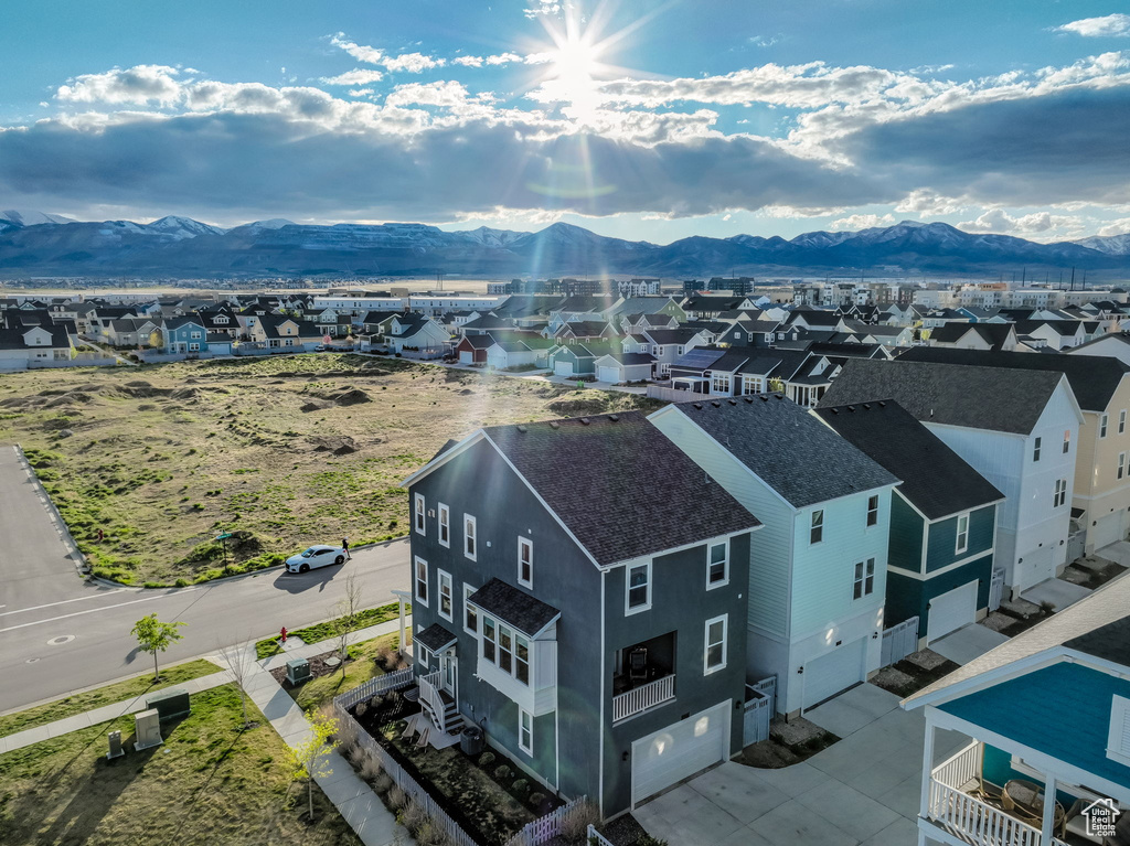 View of mountain backdrop featuring nearby suburban area