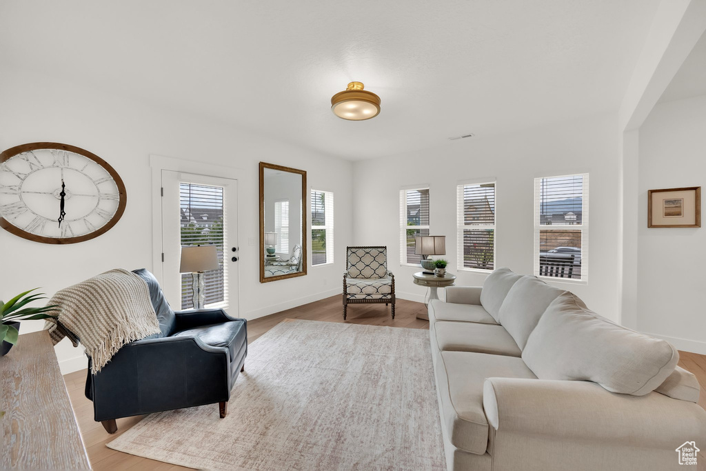 Living room with wood finished floors and baseboards