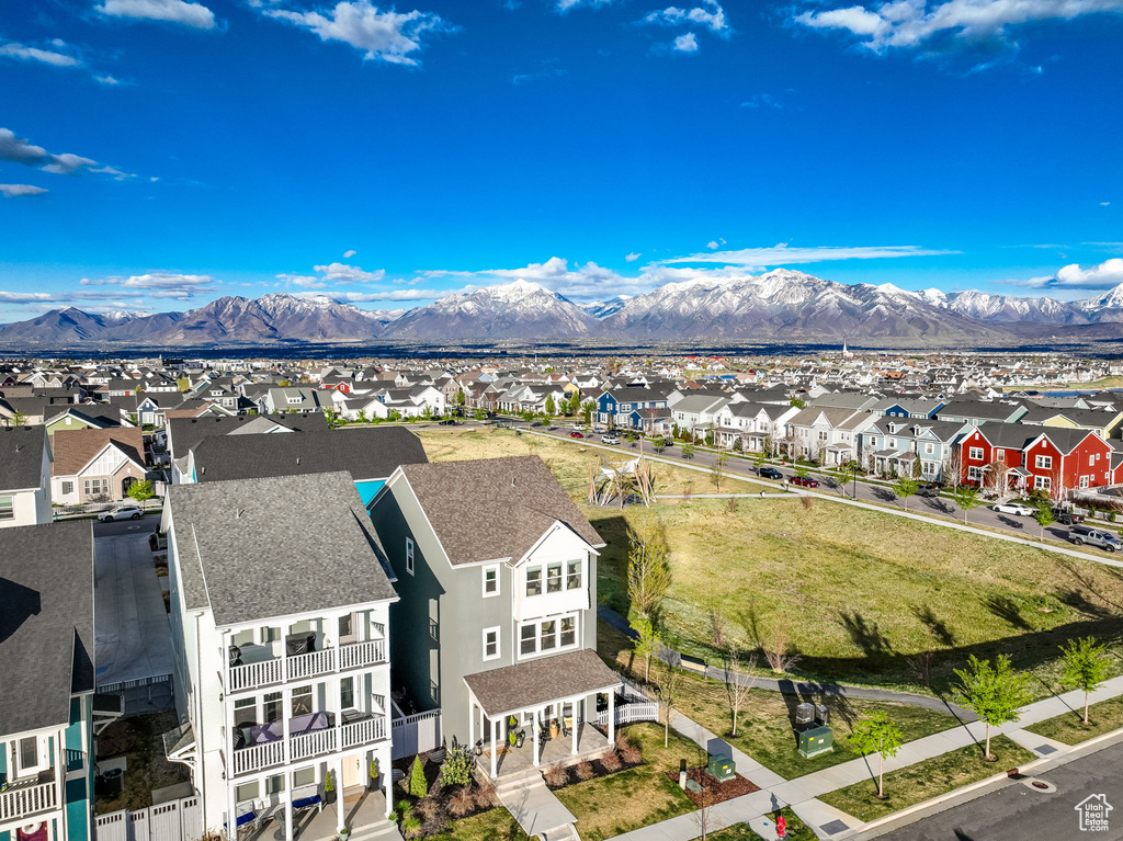 Aerial view of residential area featuring a mountainous background
