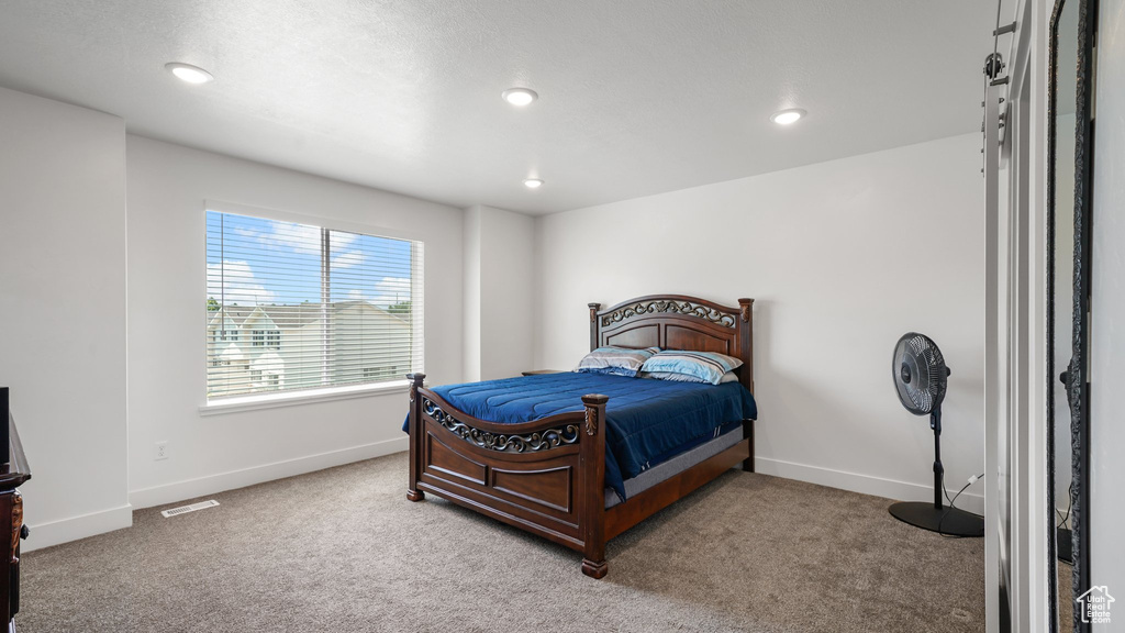 Bedroom with carpet, baseboards, and recessed lighting