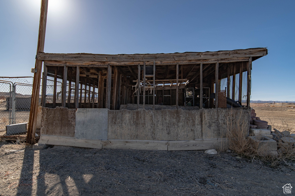 Rear view of house featuring an exterior structure and an outdoor structure