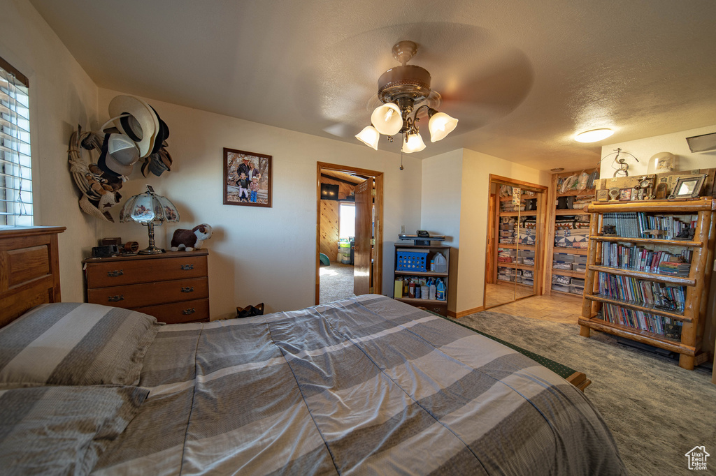 Bedroom with carpet flooring and ceiling fan