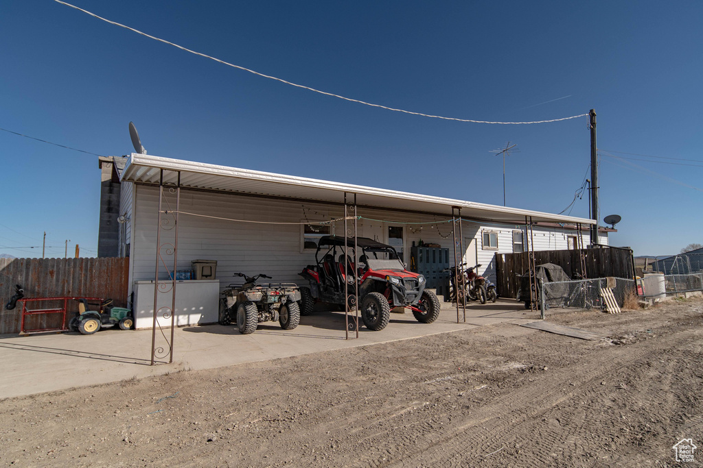 View of outbuilding with an attached carport