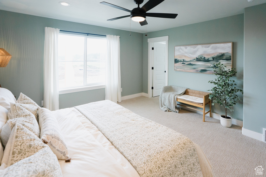 Carpeted bedroom featuring baseboards, a ceiling fan, and recessed lighting
