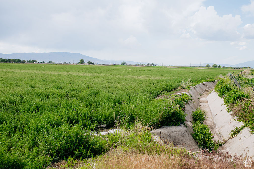 View of yard with a view of countryside and a mountain view