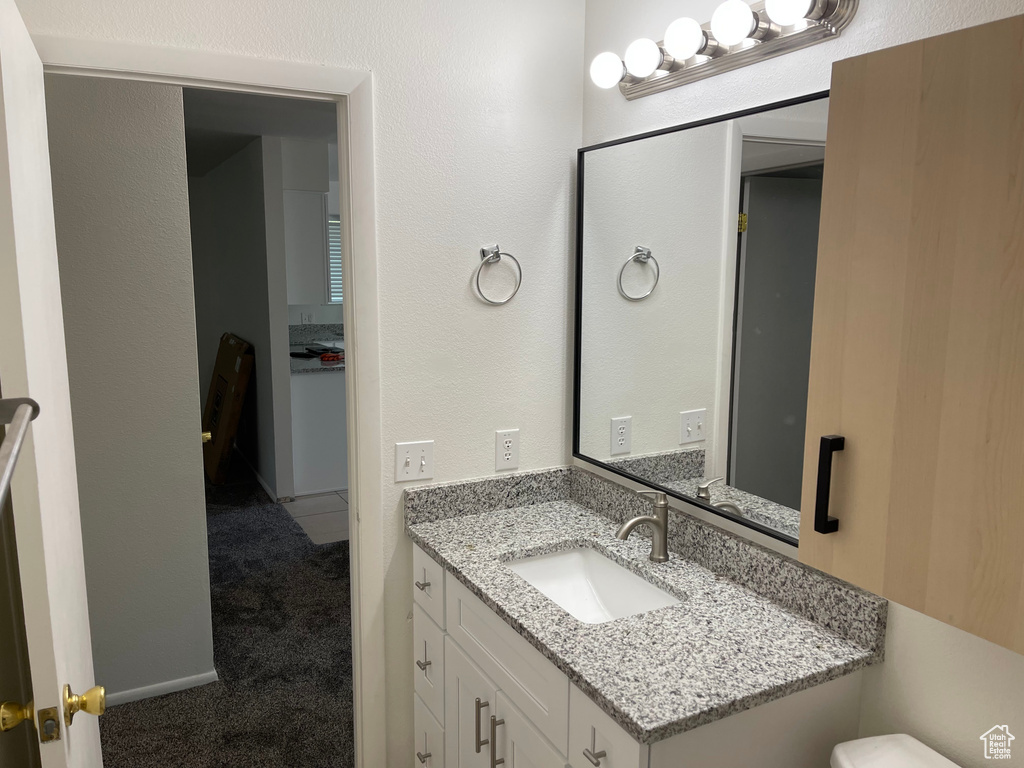 Bathroom with vanity and toilet