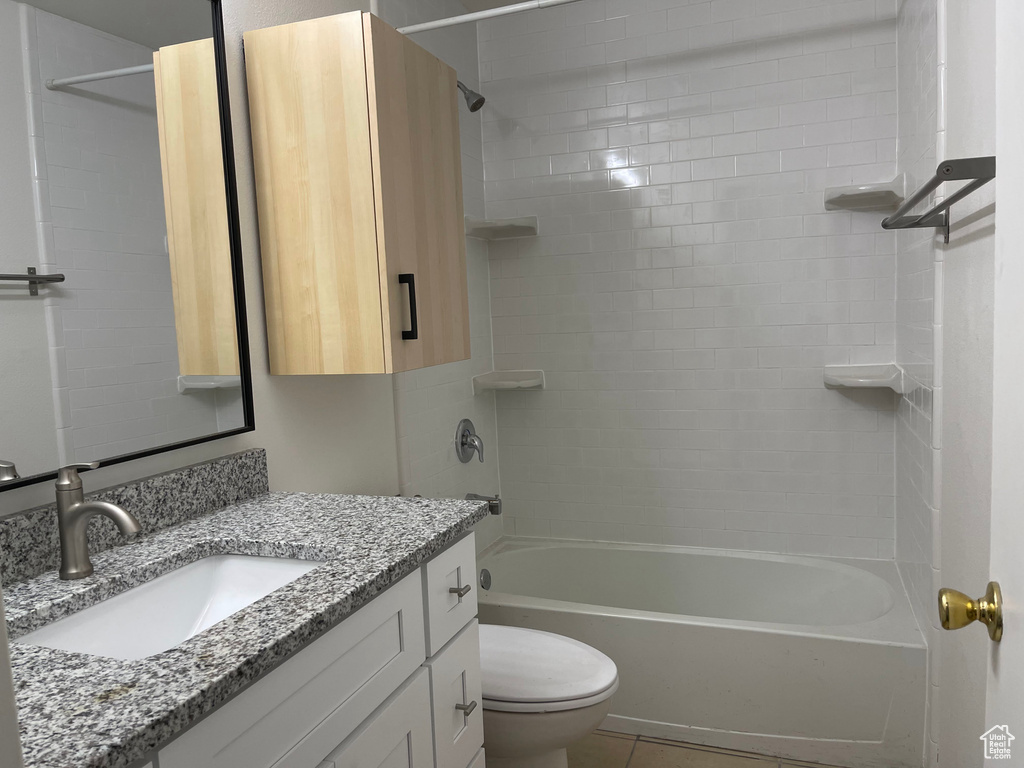 Bathroom with vanity, toilet, and bathtub / shower combination