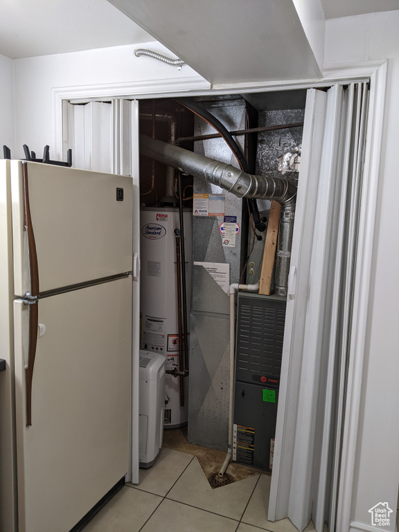 Utility room featuring water heater