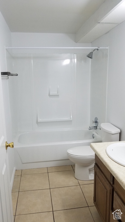 Full bath with vanity,  shower combination, tile patterned flooring, and toilet