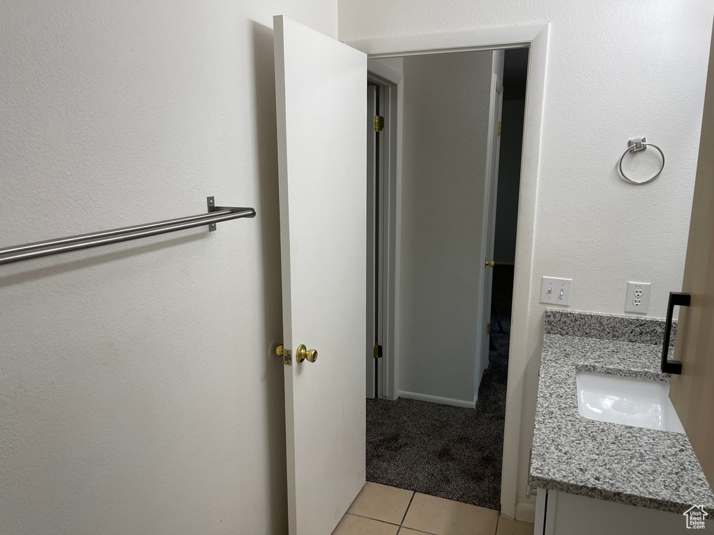 Bathroom with vanity and tile patterned flooring