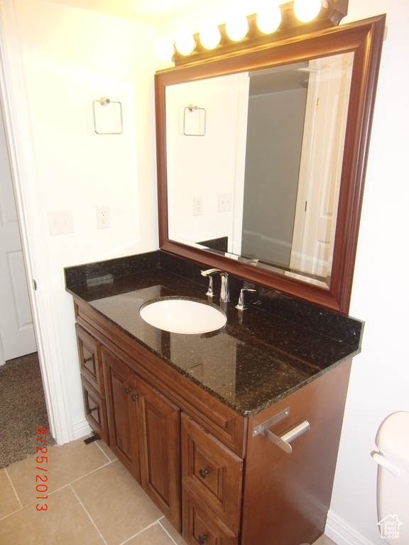 Bathroom with vanity and tile patterned floors