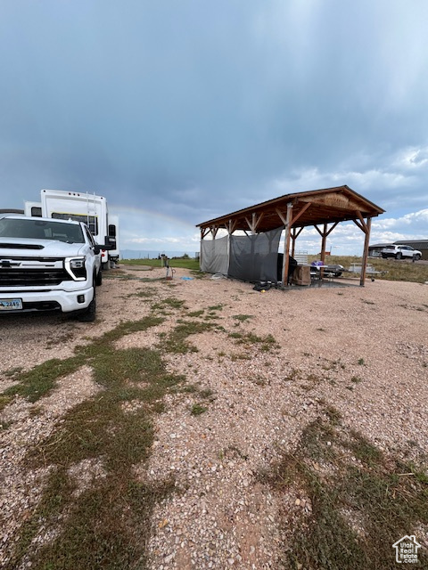 View of yard with a carport