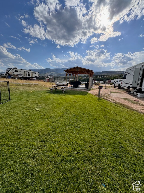 View of grassy yard featuring a gazebo
