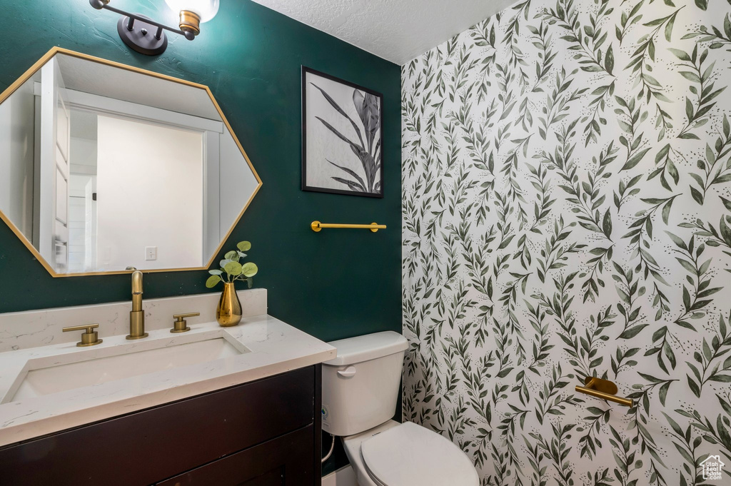 Bathroom featuring toilet and vanity