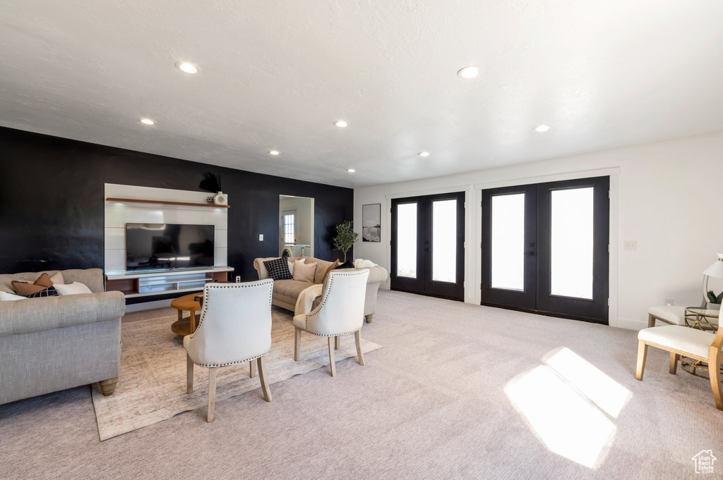 Living room featuring recessed lighting, light carpet, and french doors