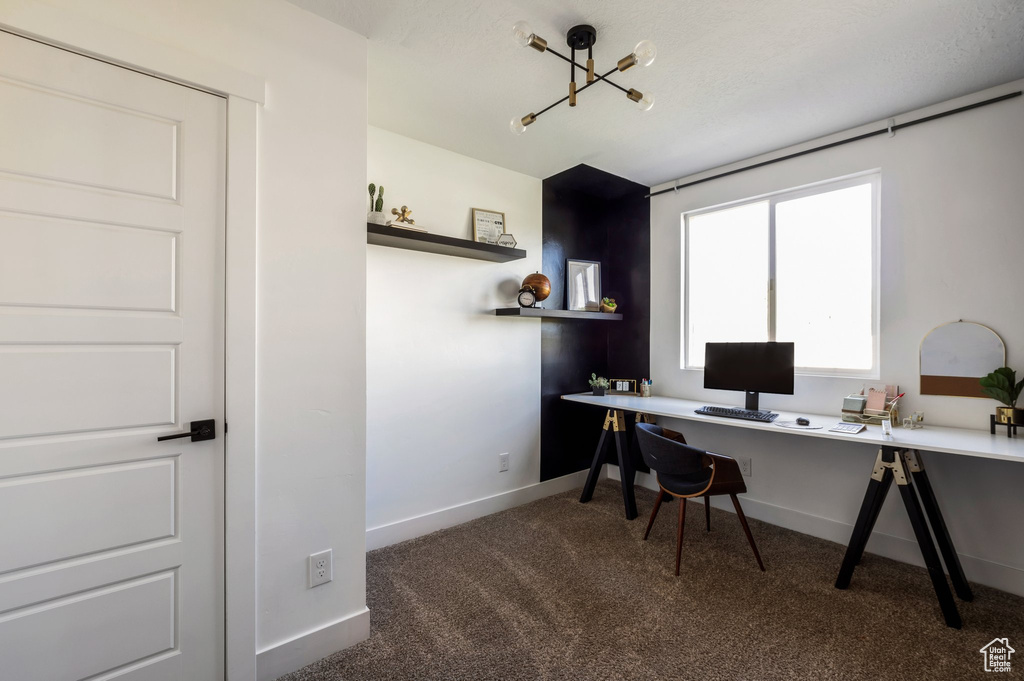 Carpeted office featuring baseboards