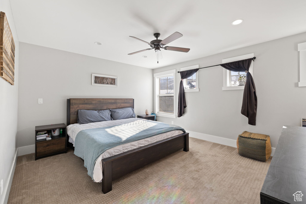 Bedroom featuring baseboards, recessed lighting, ceiling fan, and carpet floors