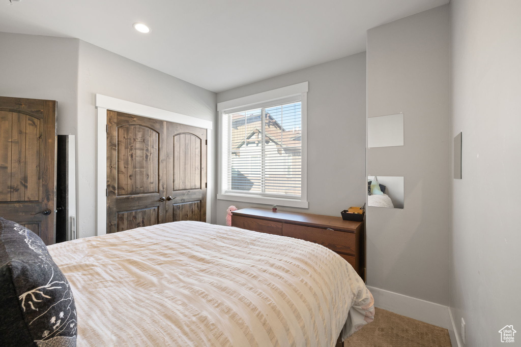 Carpeted bedroom featuring baseboards and recessed lighting