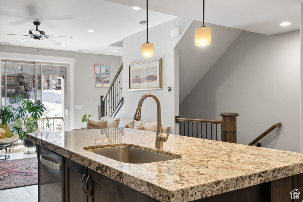 Kitchen with a sink, ceiling fan, dark brown cabinetry, decorative light fixtures, and recessed lighting
