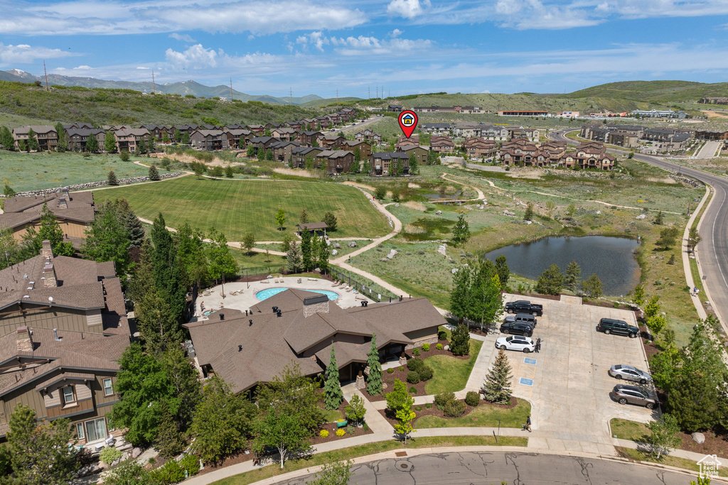 Aerial view of property\\\\\\\\\\\\\\\\\\\\\\\\\\\\\\\'s location featuring nearby suburban area and a water and mountain view