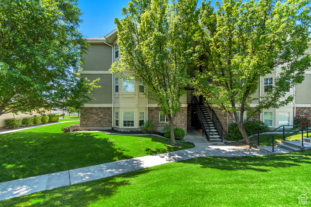 View of property with stairway