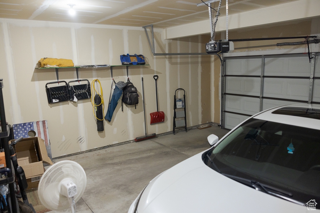 Garage featuring a garage door opener