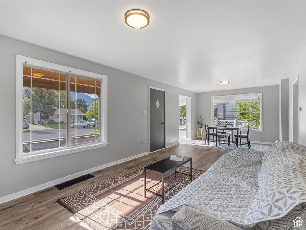Living area featuring baseboards and wood finished floors