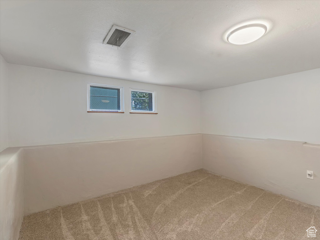 Below grade area featuring carpet