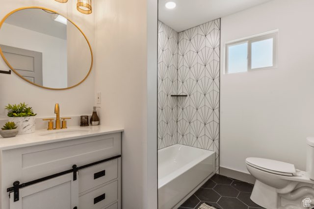 Full bath with vanity, toilet, tile patterned floors, shower / bath combination, and recessed lighting